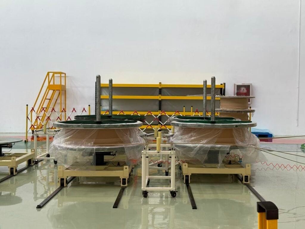 High-voltage transformer prototypes undergoing testing in a manufacturing facility, emphasizing innovative Taishan Transformer electrical and power transmission solutions.