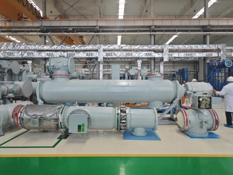 Advanced power transformer equipment used in electricity transmission, featuring high-capacity industrial components at Taishan Transformer factory.