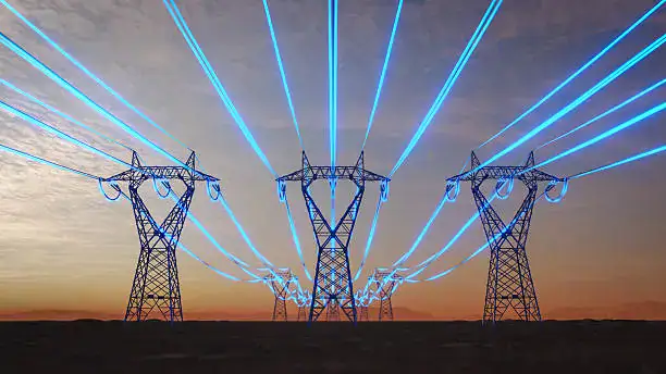 High-voltage power transmission towers with laser light displays, showcasing advanced electric transformer technology and innovative energy solutions by Taishan Transformer.