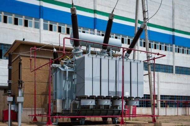 High-voltage power transformer at Taishan Transformer factory, showcasing industrial electrical equipment used for voltage regulation and power distribution in energy infrastructure.