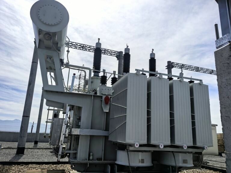 High-voltage power transformer at Taishan Transformer factory, showcasing advanced electrical equipment for power distribution and energy transmission.